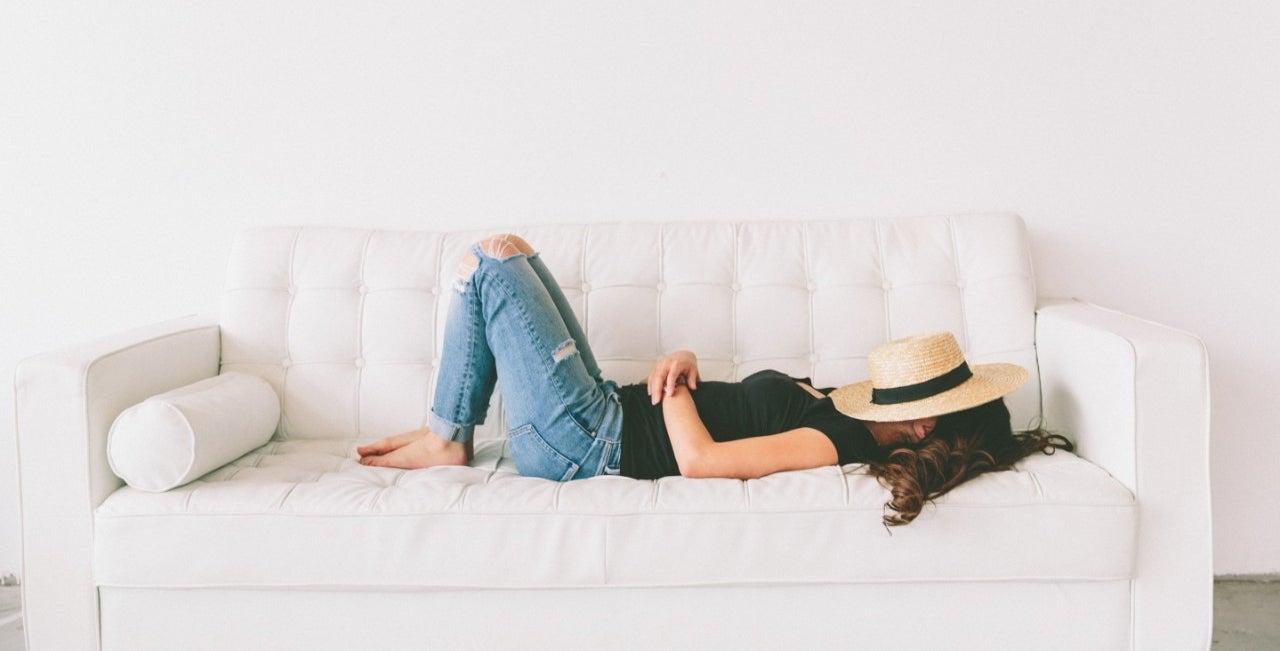 destressing girl relaxing on a couch