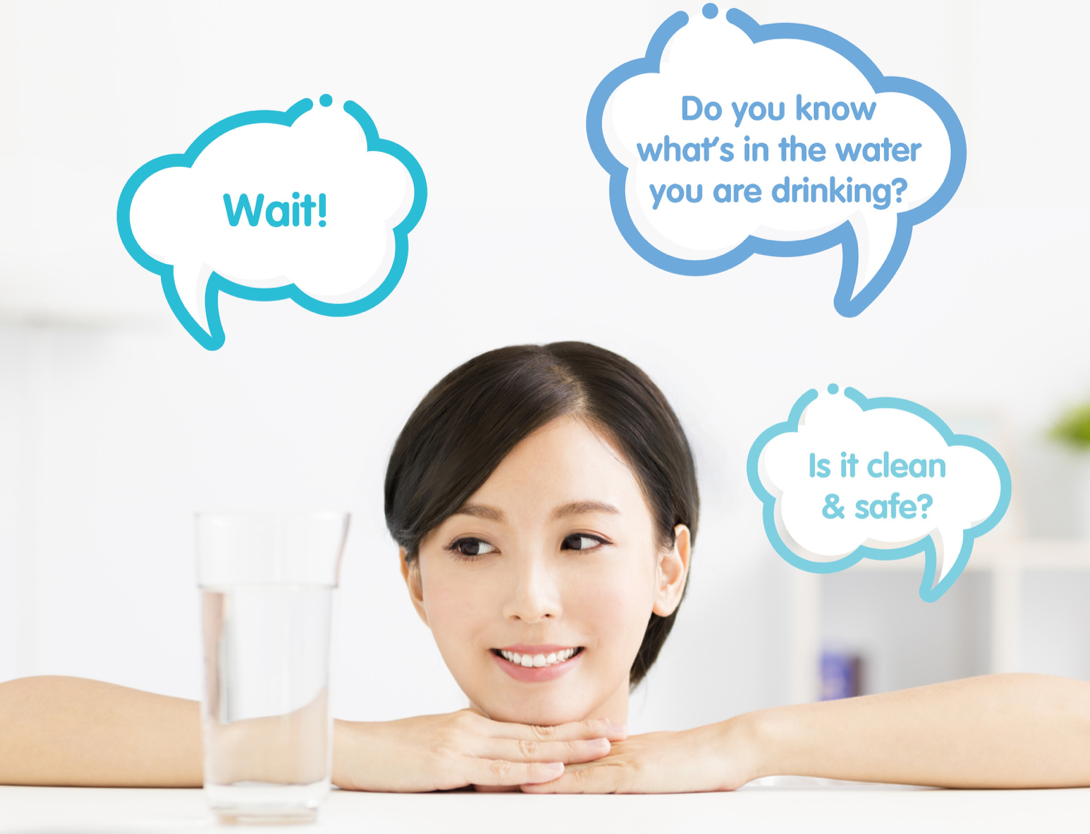 A First in Nu Skin's History A woman looking at a glass of water questioning if the water is clean and safe.