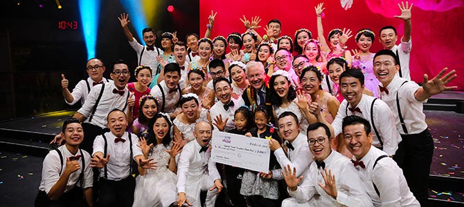 Nu Skin's Got Talent Korea Nu Skin Sales Leaders pose for a picture as they are given a giant check to their Nu Skin charity of choice as their prize for winning Nu Skin’s Got Talent.